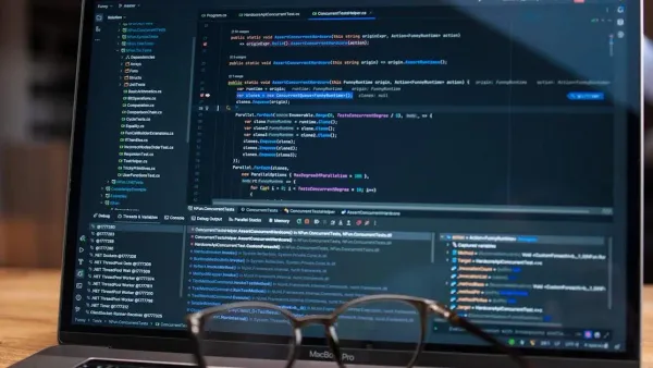 Visualizing Claude code context window too small issue with code editor open on laptop screen